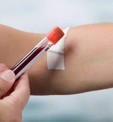 depositphotos_182993440-stock-photo-hand-holding-blood-probe-in